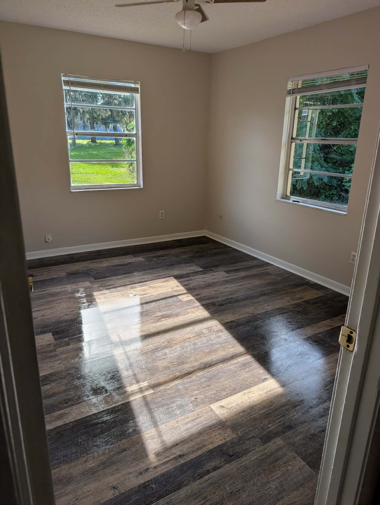 Real job — sparkling clean residential bedroom windows with sunlight pouring in onto polished floors
